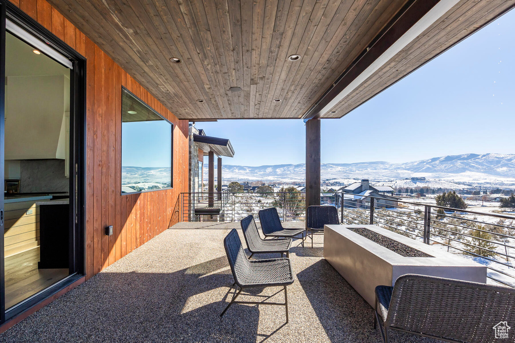 Balcony featuring a mountain view and outdoor lounge area