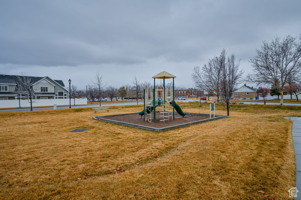 View of playground featuring a lawn