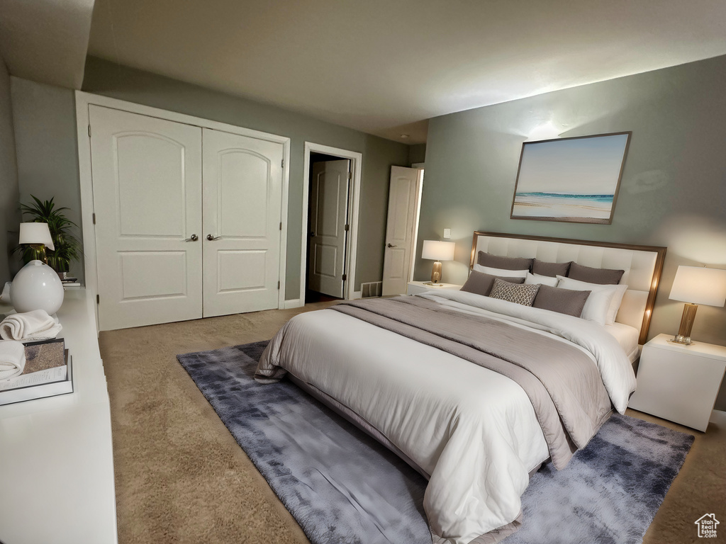 Bedroom featuring a closet and carpet flooring