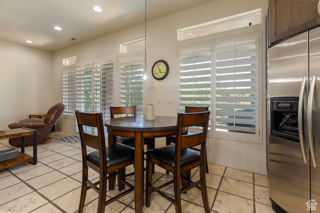 Dining space featuring light tile floors