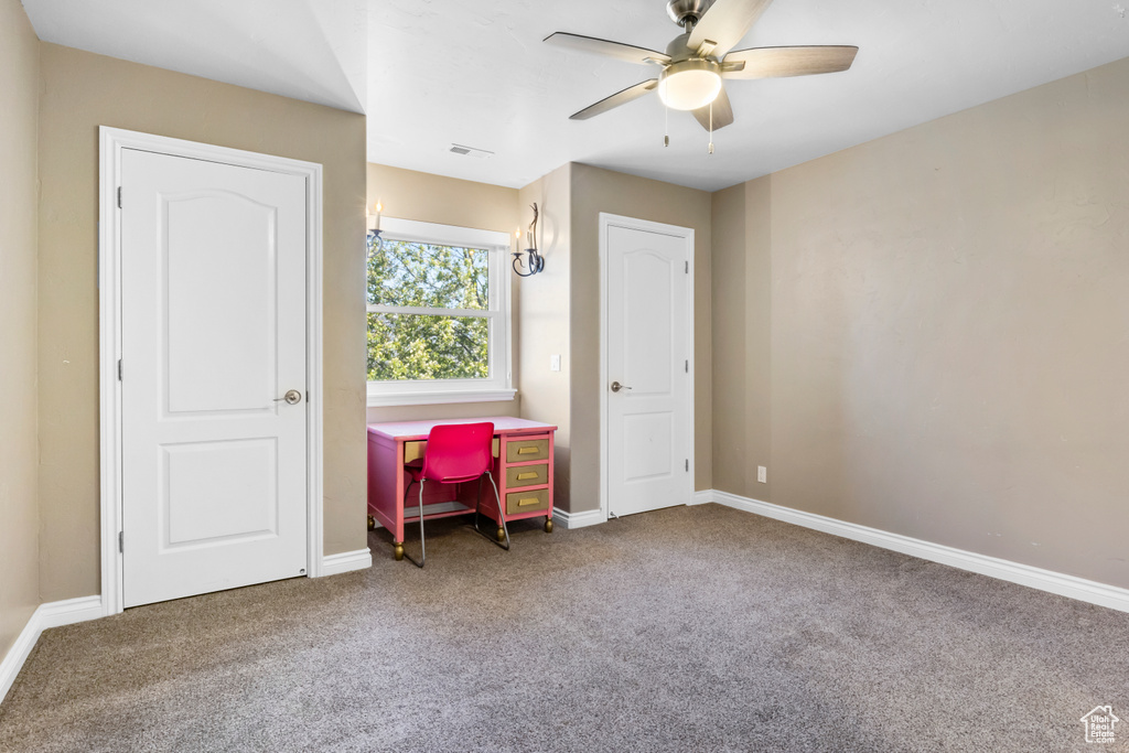 Bedroom with ceiling fan and carpet flooring