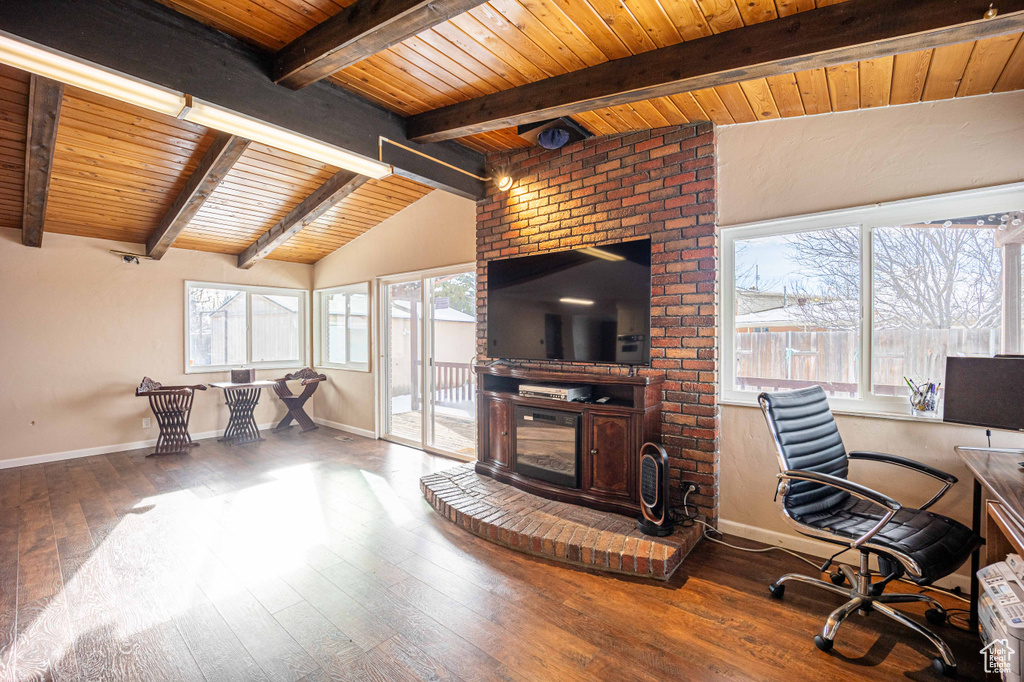 Office area with brick wall, dark hardwood / wood-style flooring, vaulted ceiling with beams, and wooden ceiling