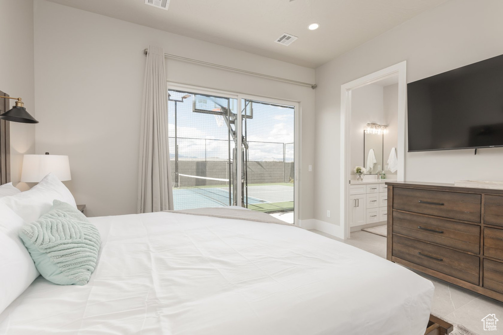Bedroom featuring ensuite bath and access to exterior