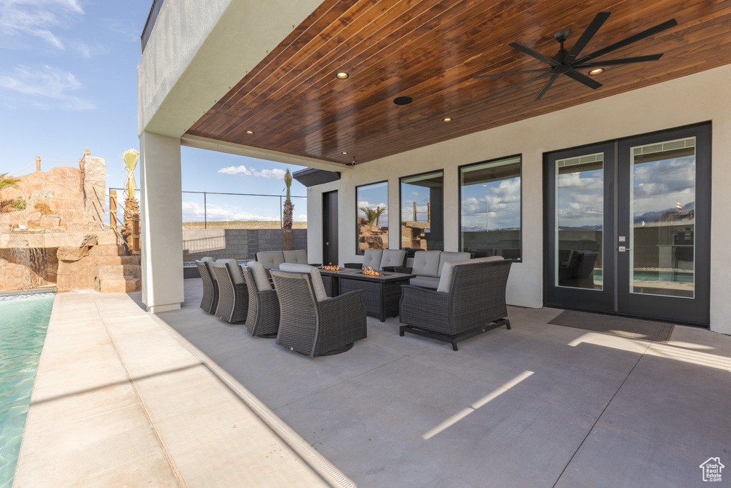 View of terrace featuring ceiling fan and an outdoor hangout area