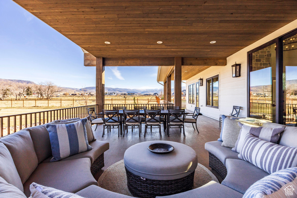 View of patio / terrace with a mountain view and an outdoor living space