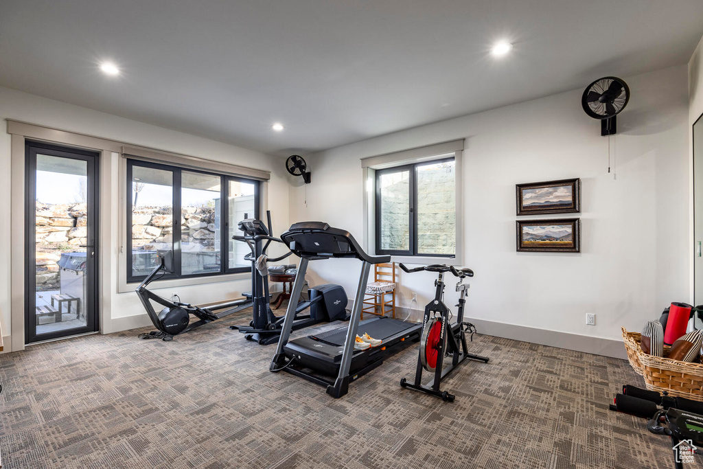 Exercise room with dark carpet