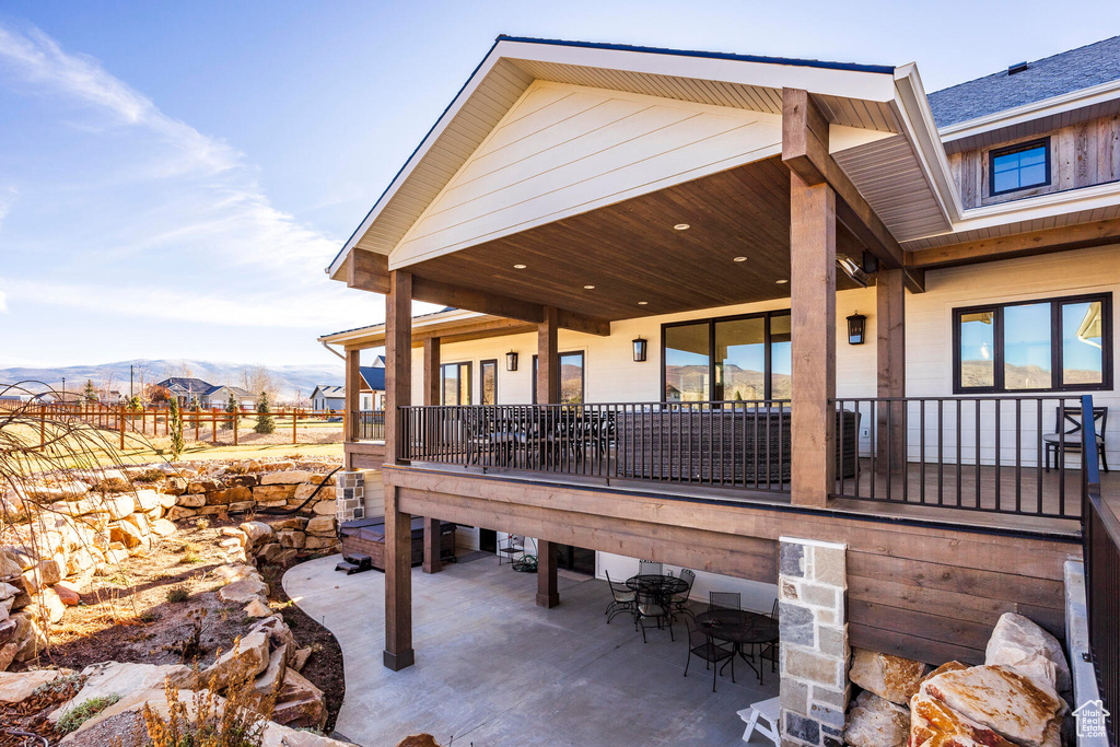 Exterior space featuring a mountain view and a patio area
