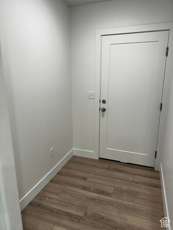 Doorway featuring wood-type flooring