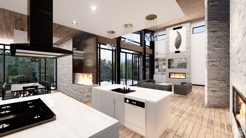 Kitchen featuring pendant lighting, white cabinetry, a chandelier, a fireplace, and wooden ceiling