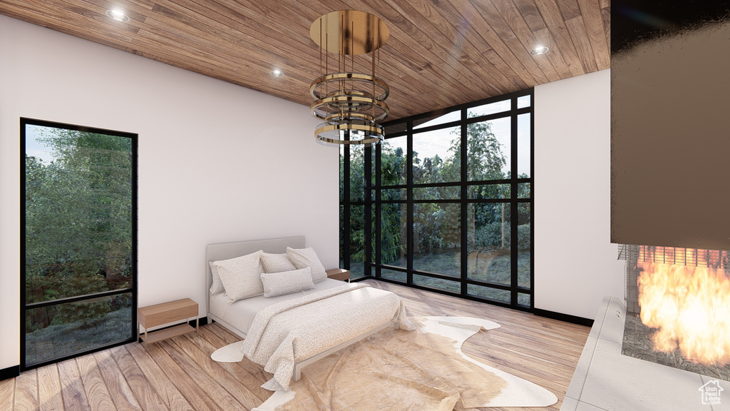 Bedroom with wood ceiling, a chandelier, floor to ceiling windows, and light wood-type flooring