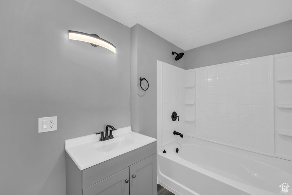 Bathroom featuring vanity and shower / tub combination