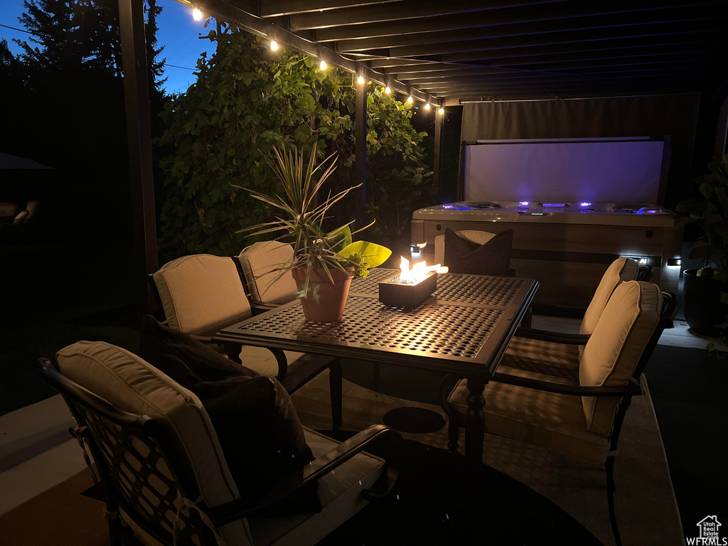Patio terrace at twilight with a hot tub