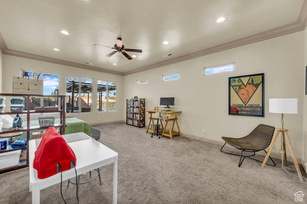 Game room featuring crown molding, ceiling fan, and light carpet