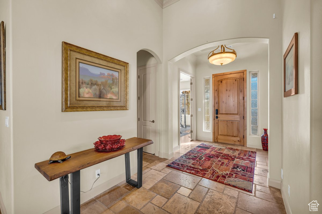 Tiled foyer entrance with a high ceiling