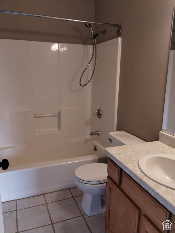 Full bathroom featuring vanity, shower / washtub combination, tile floors, and toilet