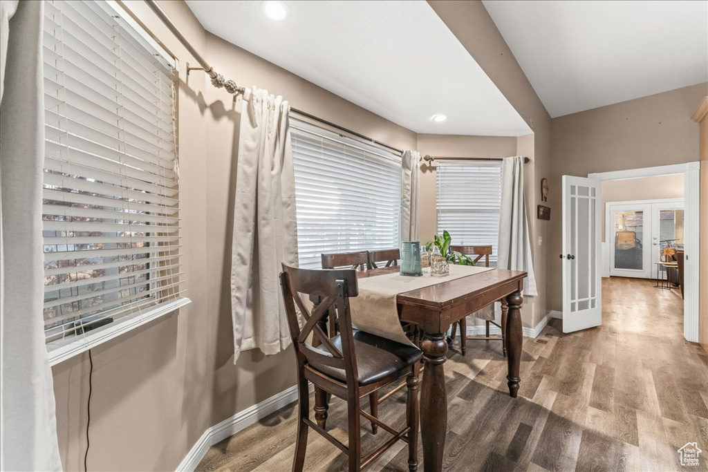 Dining area featuring hardwood / wood-style flooring and french doors