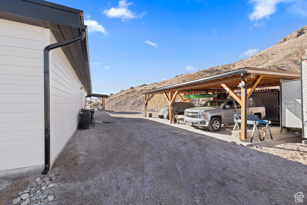 Exterior space featuring a carport and a mountain view