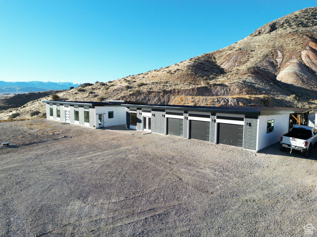 Single story home featuring a mountain view and a garage