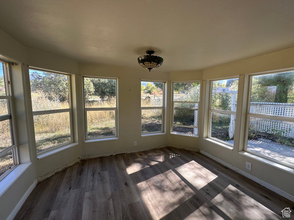 Unfurnished sunroom with a healthy amount of sunlight
