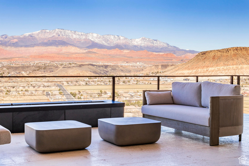 Wooden terrace with a mountain view and outdoor lounge area