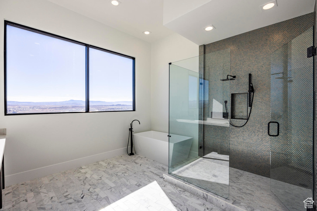 Bathroom featuring a shower with shower door and tile patterned flooring