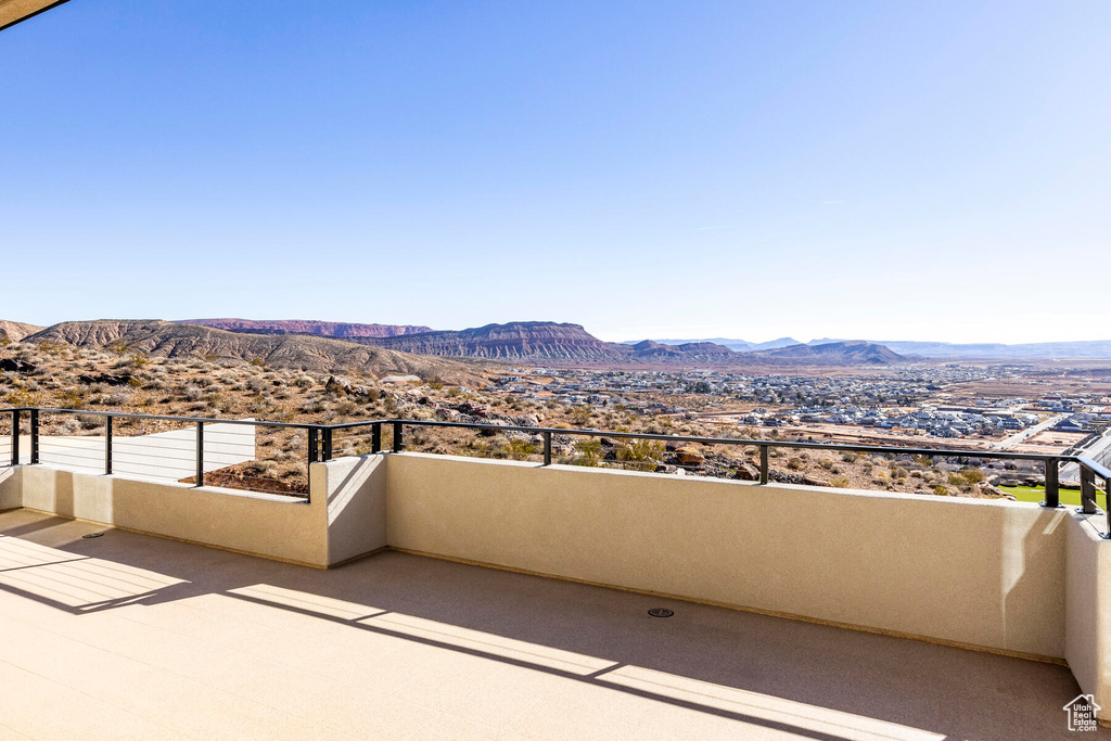 View of patio / terrace with a mountain view and a balcony