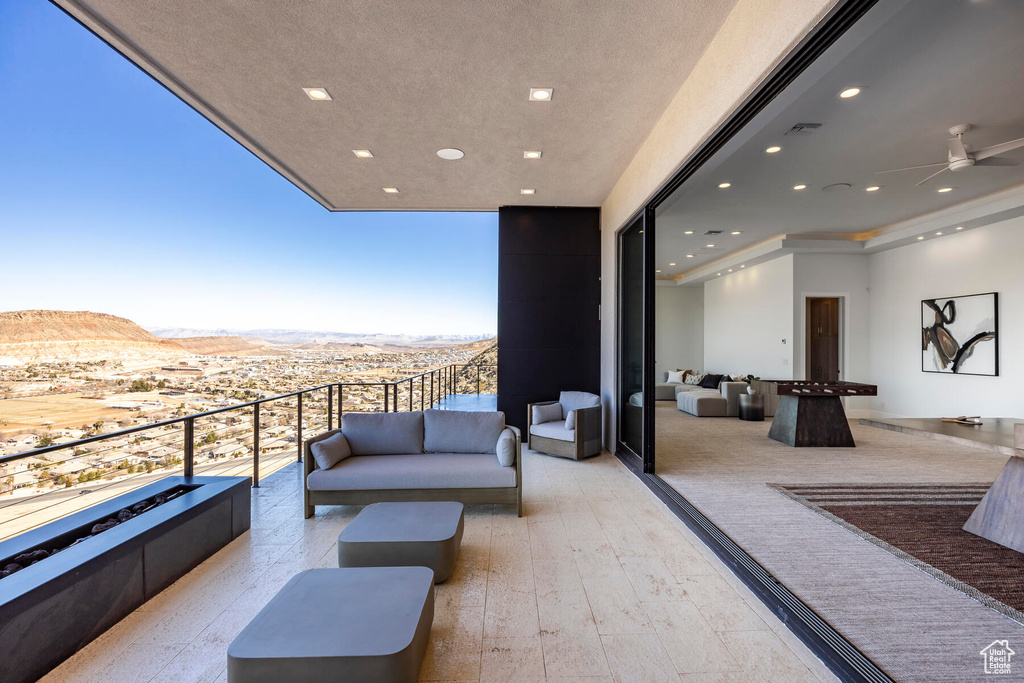 Balcony featuring a mountain view and outdoor lounge area