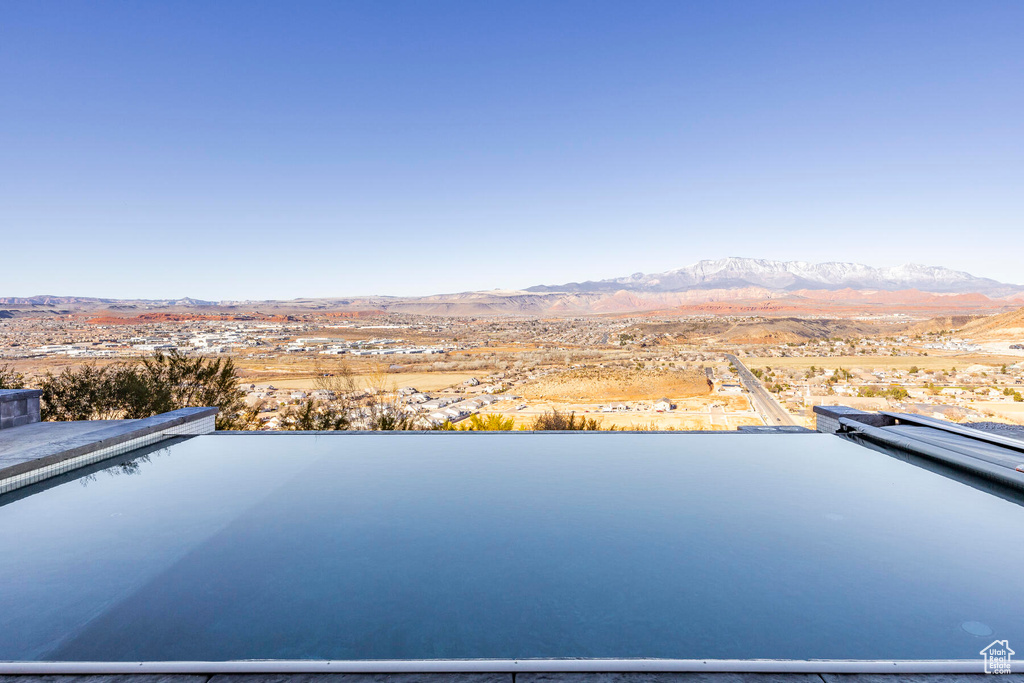 Birds eye view of property with a mountain view