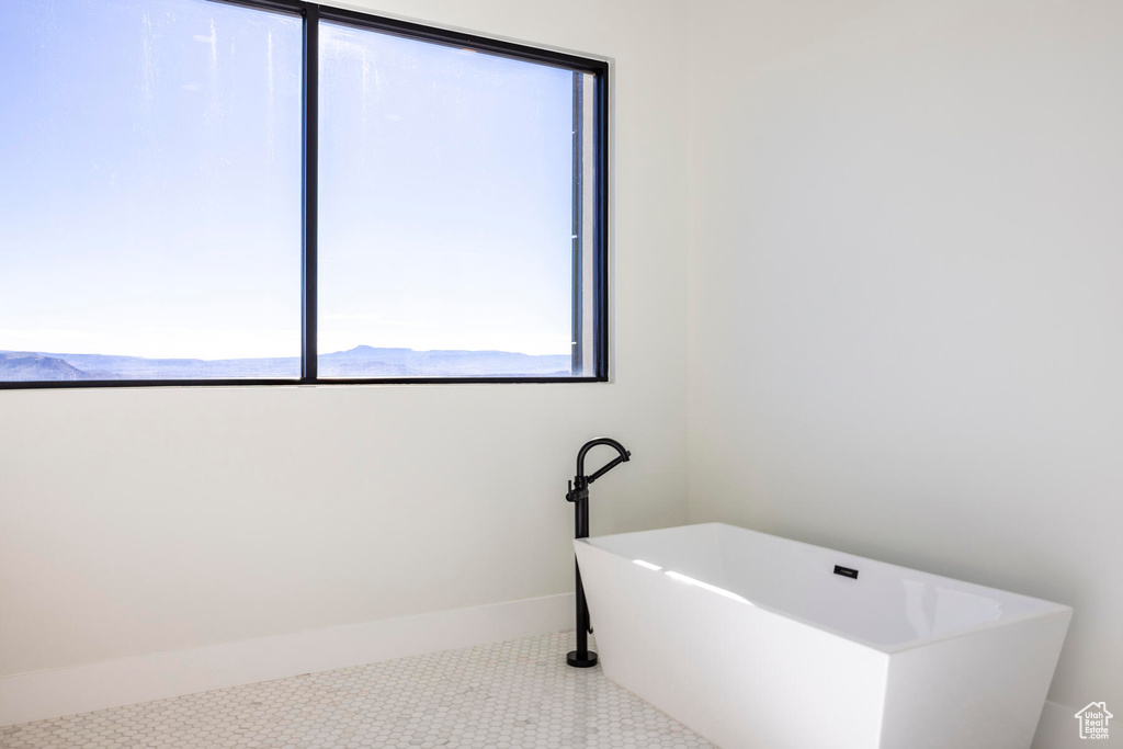 Bathroom with tile patterned flooring