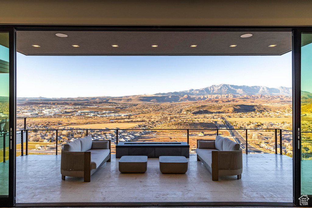 Interior space featuring a mountain view and an outdoor living space