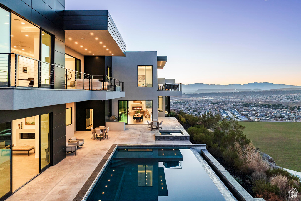 Exterior space with a patio and a mountain view