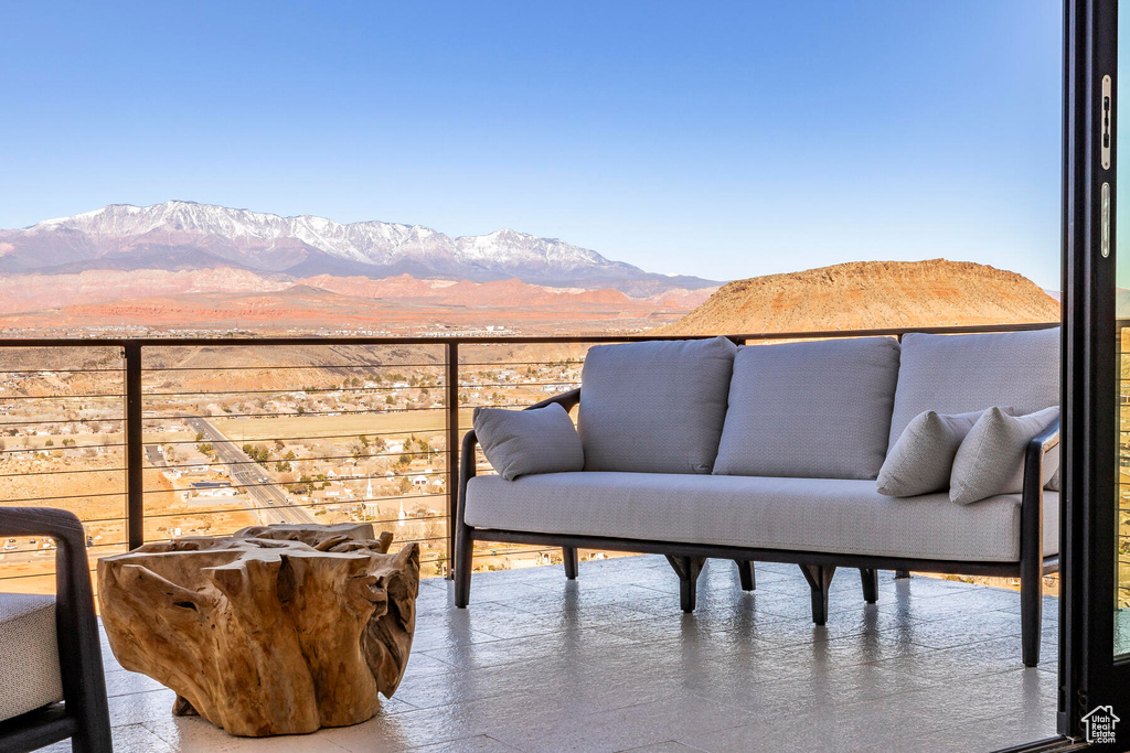 Balcony featuring outdoor lounge area and a mountain view