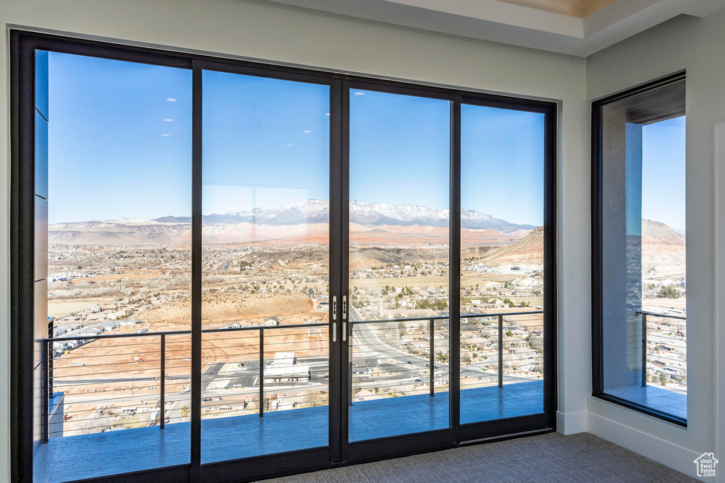 Interior space featuring carpet and a mountain view