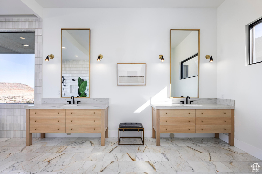 Bathroom featuring vanity and tile patterned flooring