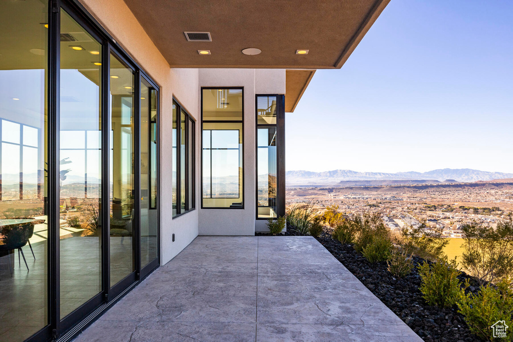 Balcony featuring a patio area and a mountain view