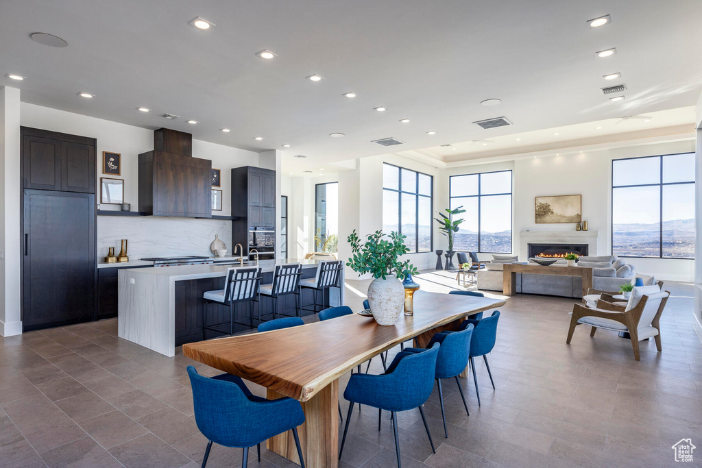 Dining area with sink and tile patterned floors