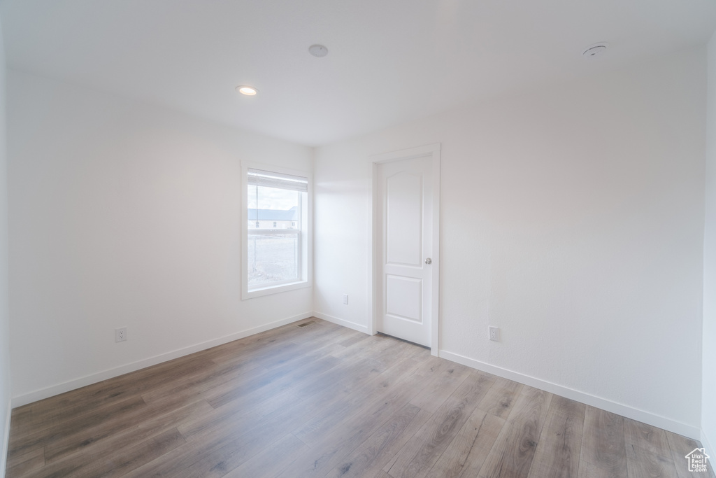 Unfurnished room with light hardwood / wood-style floors