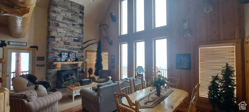 Interior space featuring a fireplace and a towering ceiling