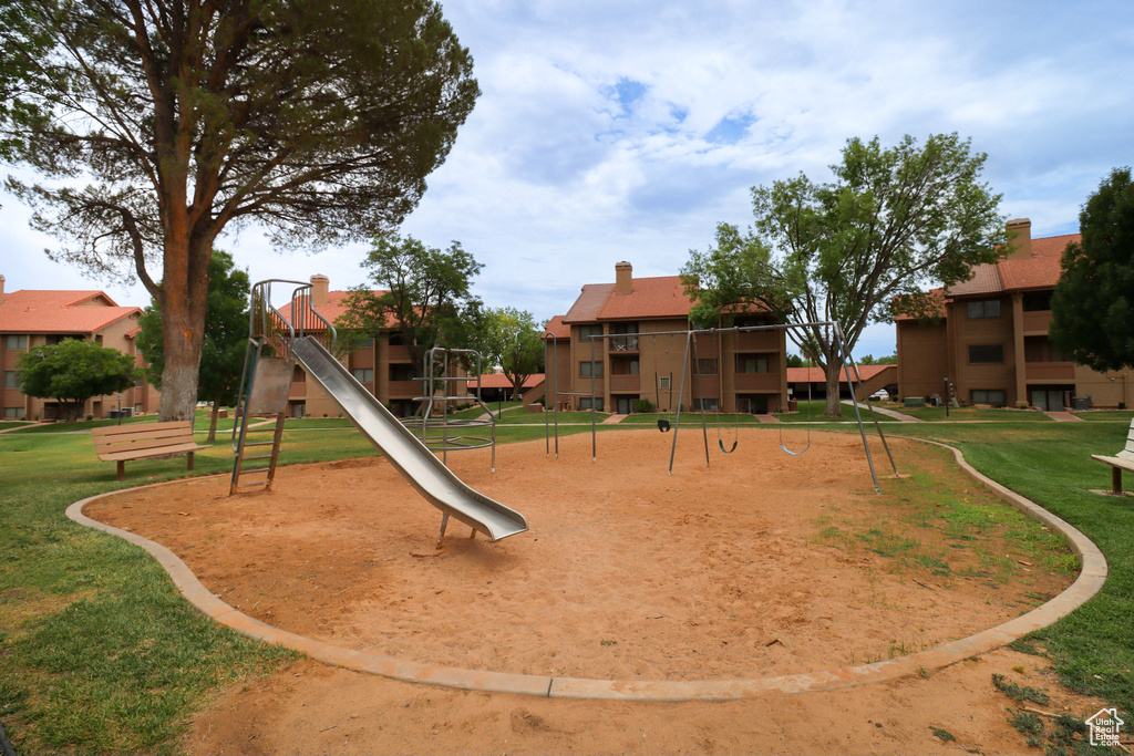 View of play area with a lawn