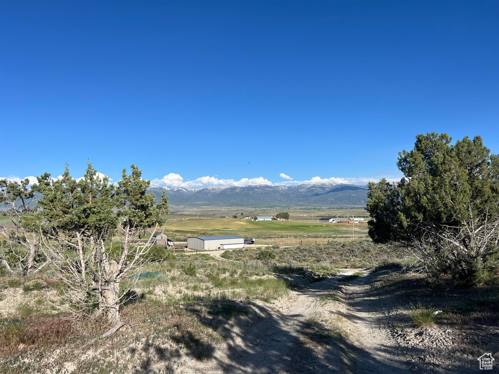 Property view of mountains with a rural view