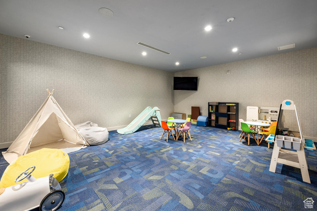 Playroom featuring dark carpet