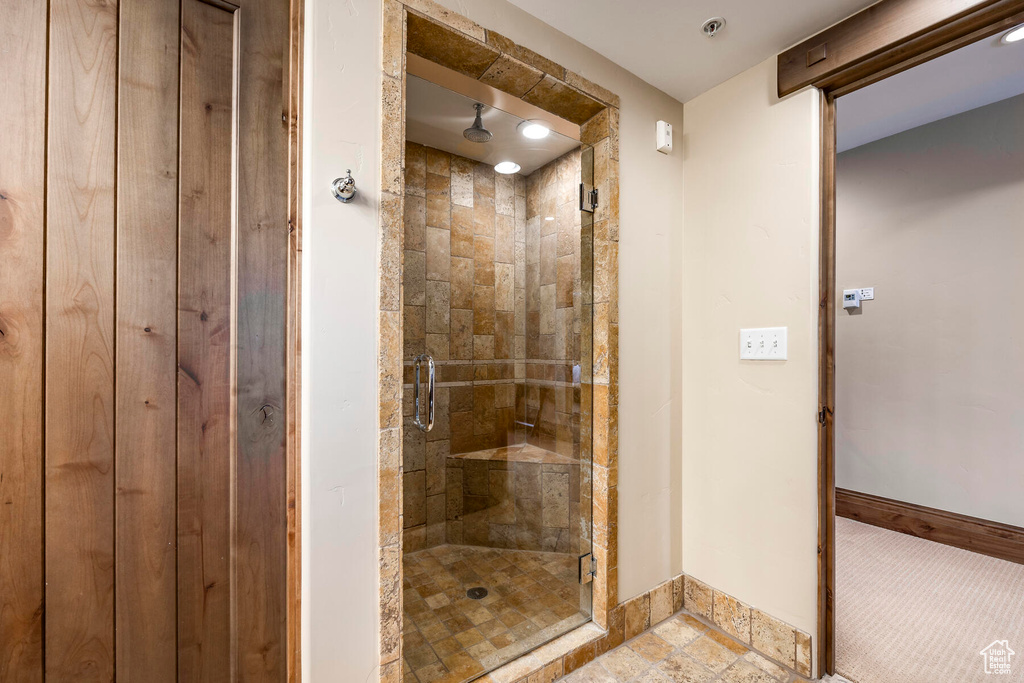 Bathroom with a shower with door