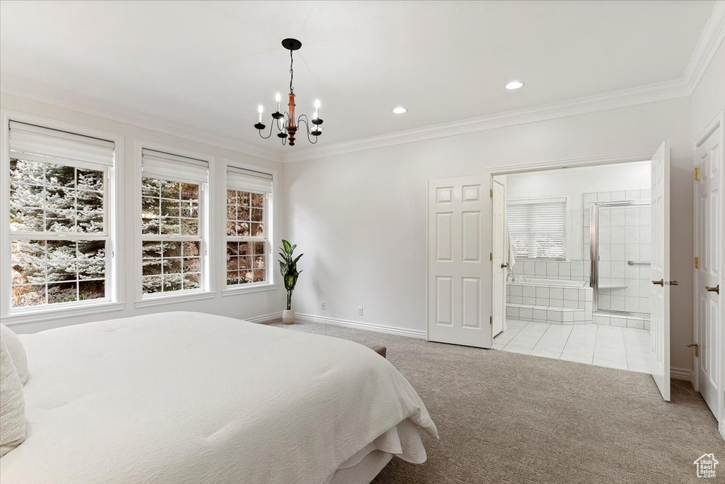 Tiled bedroom with a chandelier, ensuite bath, and ornamental molding