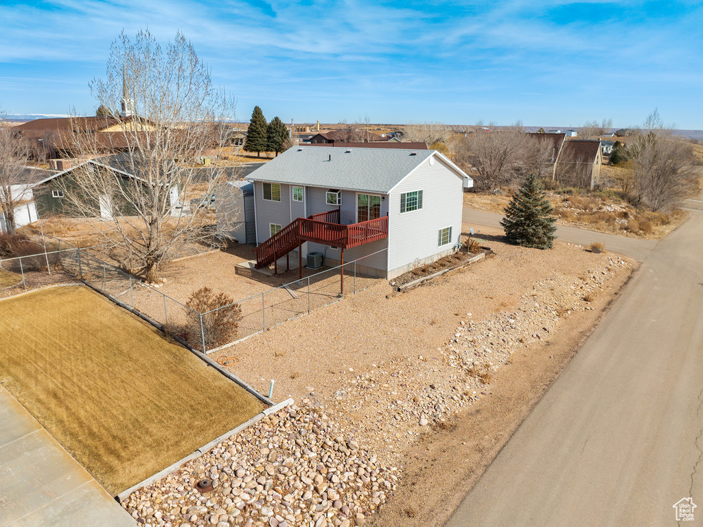 View of front of house with a wooden deck