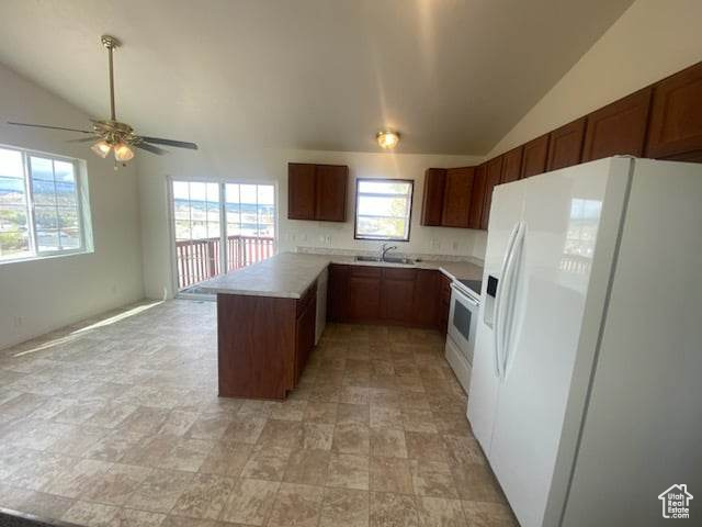 Kitchen featuring kitchen peninsula, white appliances, ceiling fan, light tile flooring, and tasteful backsplash