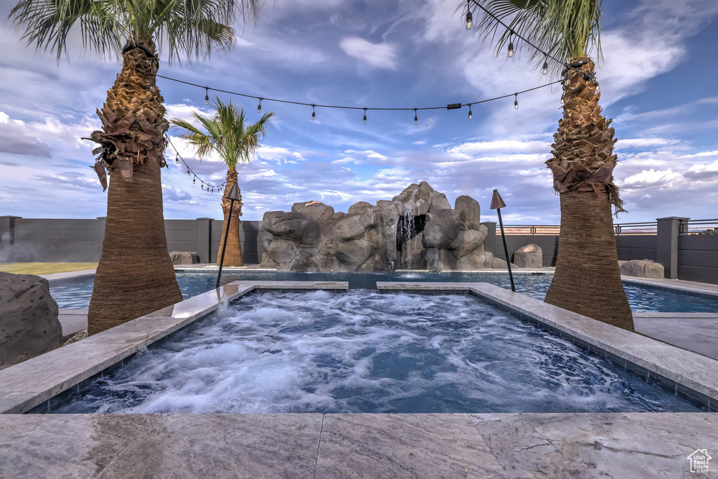View of pool featuring an in ground hot tub