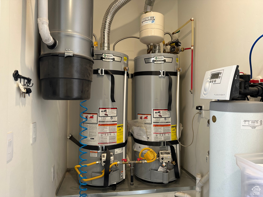 Utility room with water heater and strapped water heater