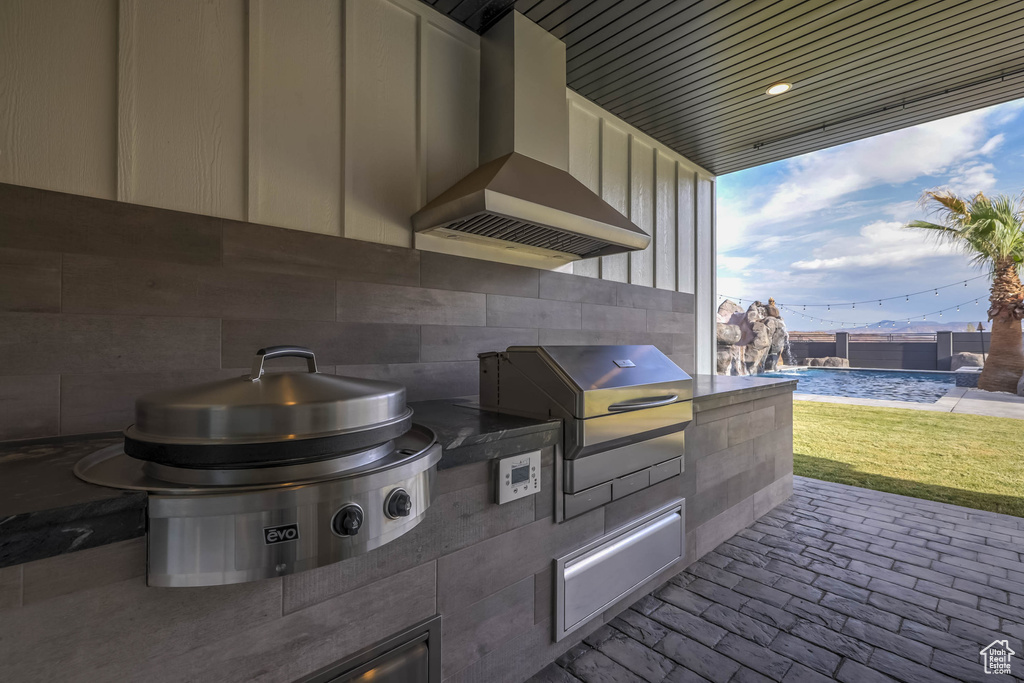 Exterior space featuring an outdoor kitchen