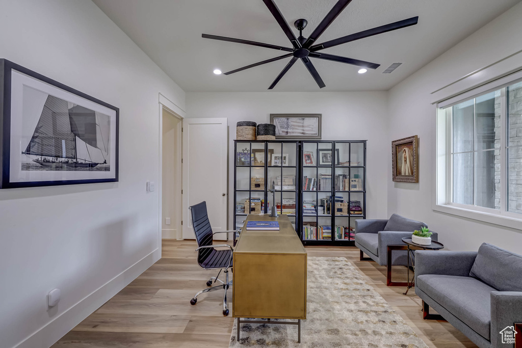 Office area featuring light hardwood / wood-style floors and ceiling fan
