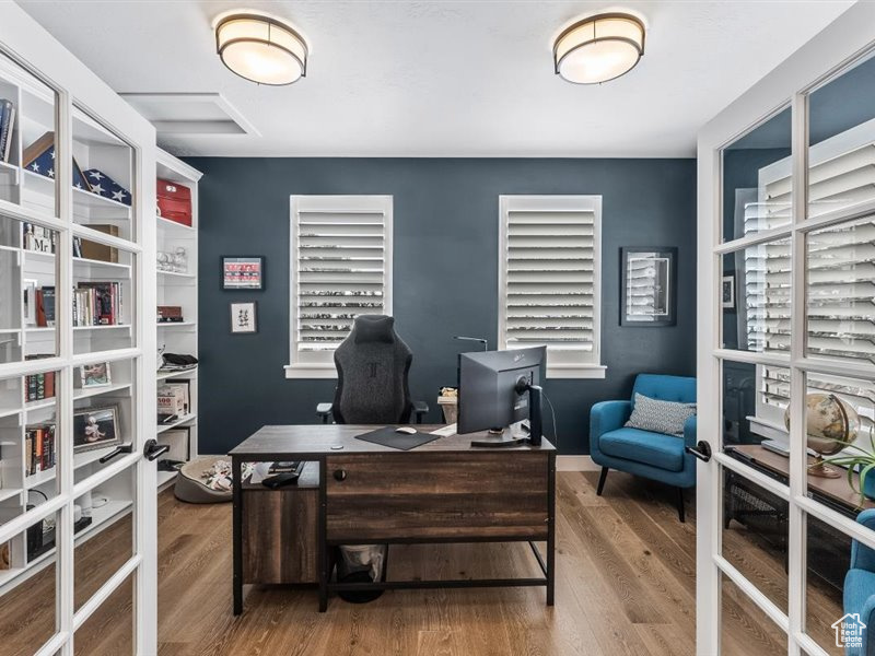Office featuring hardwood / wood-style flooring